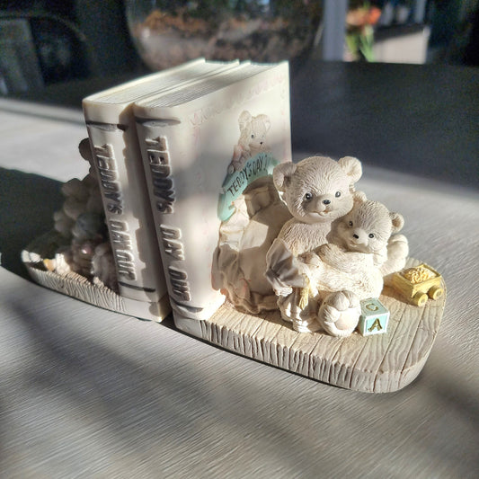 Teddy’s Day Out teddy bear bookends with bears reading and playing beside decorative books.