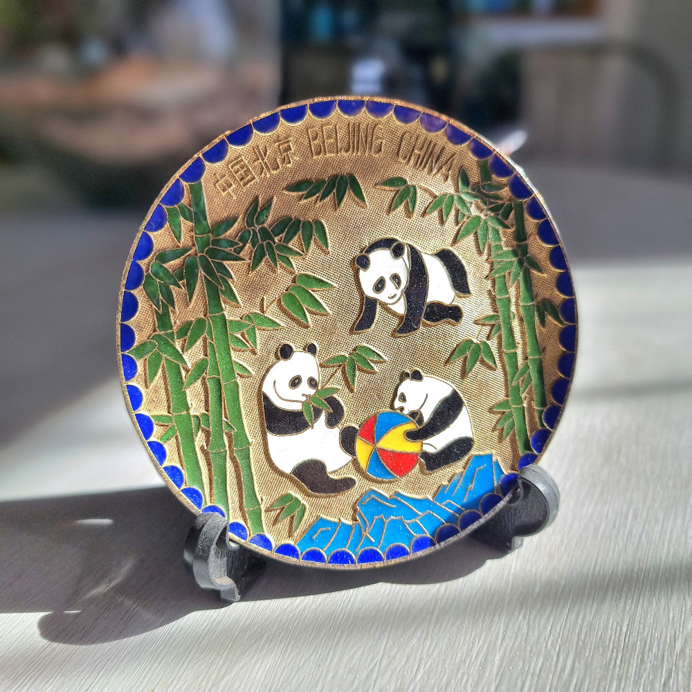 Brass dish with colourful enamel pandas playing among bamboo labelled Beijing China