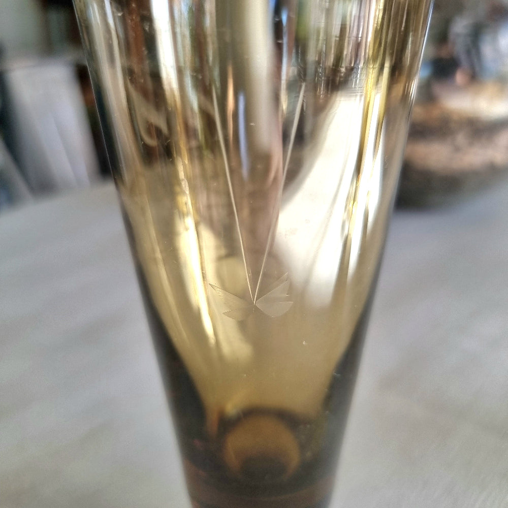 Set of four amber champagne flutes with etched floral pattern and short stems