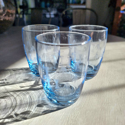 Set of three clear tumblers with blue base and bamboo etched pattern