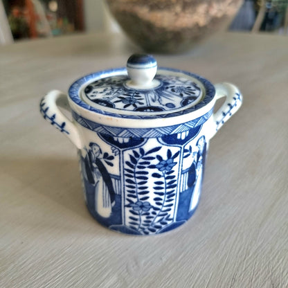 Vintage blue and white twin-handled lidded jar with chinoiserie transferware pattern