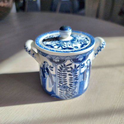Vintage blue and white twin-handled lidded jar with chinoiserie transferware pattern