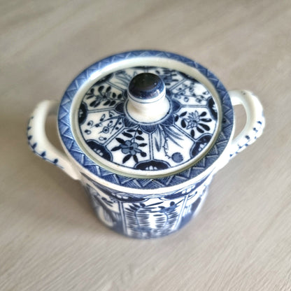 Vintage blue and white twin-handled lidded jar with chinoiserie transferware pattern
