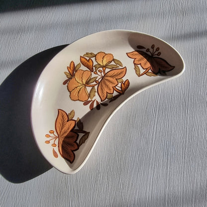 Vintage Palissy Kismet pottery serving dish with brown floral pattern and curved crescent shape