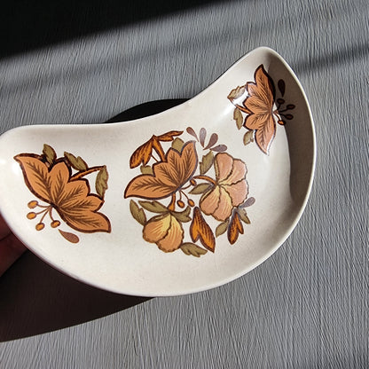 Vintage Palissy Kismet pottery serving dish with brown floral pattern and curved crescent shape