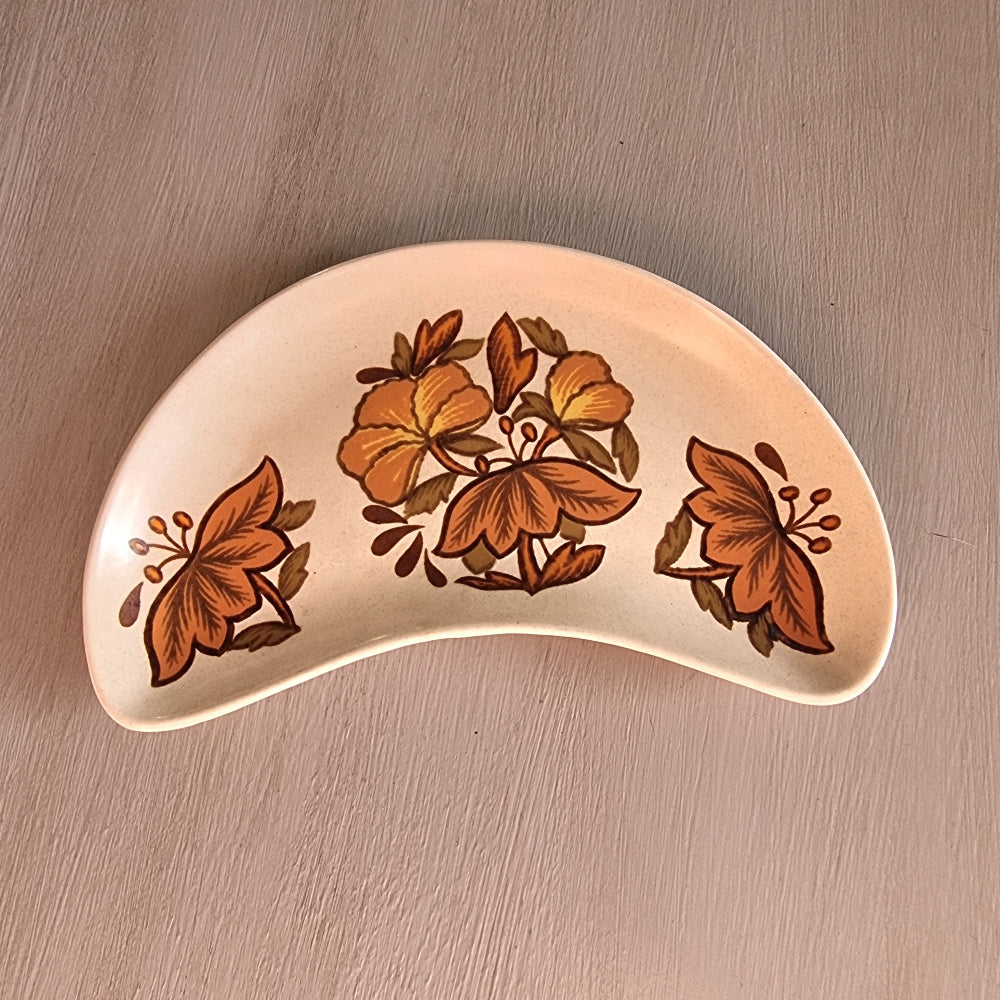 Vintage Palissy Kismet pottery serving dish with brown floral pattern and curved crescent shape