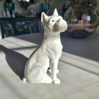 Vintage porcelain French Bulldog figurine in glossy white glaze seated upright with bat ears and wrinkled snout