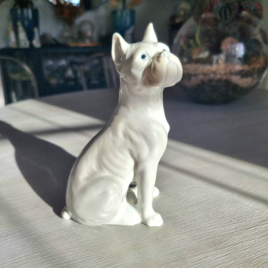 Vintage porcelain French Bulldog figurine in glossy white glaze seated upright with bat ears and wrinkled snout
