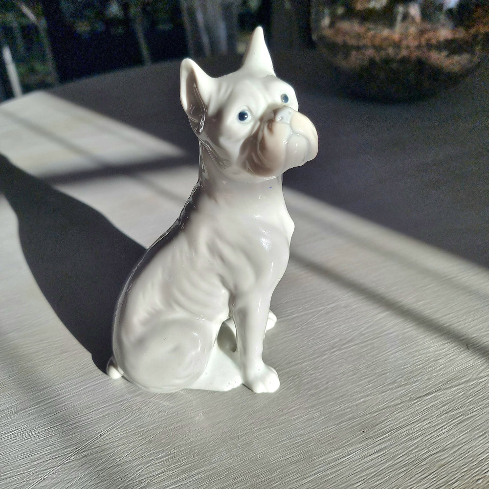 Vintage porcelain French Bulldog figurine in glossy white glaze seated upright with bat ears and wrinkled snout
