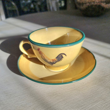 Robert Gordon rooster teacup and saucer with yellow glaze and green rim