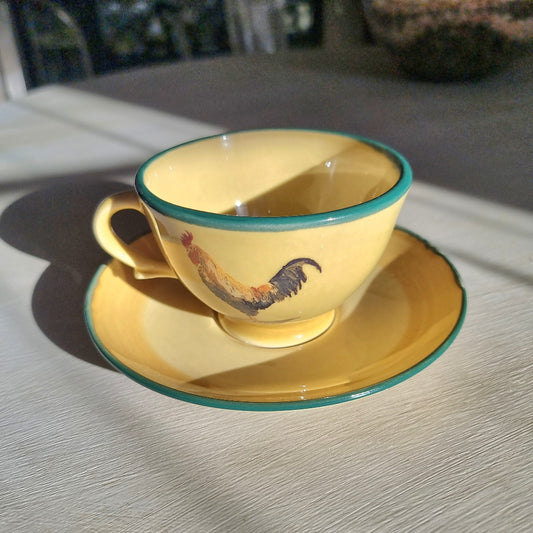 Robert Gordon rooster teacup and saucer with yellow glaze and green rim