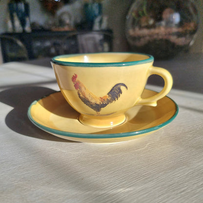Robert Gordon rooster teacup and saucer with yellow glaze and green rim