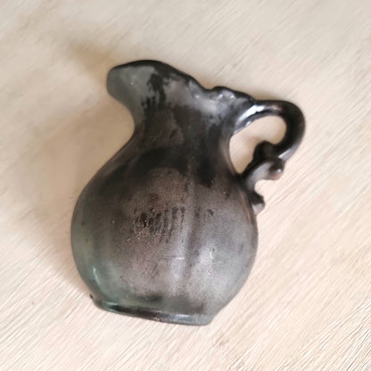 Vintage ceramic wall pocket planter with a dramatic black, bronze and silver lustre glaze