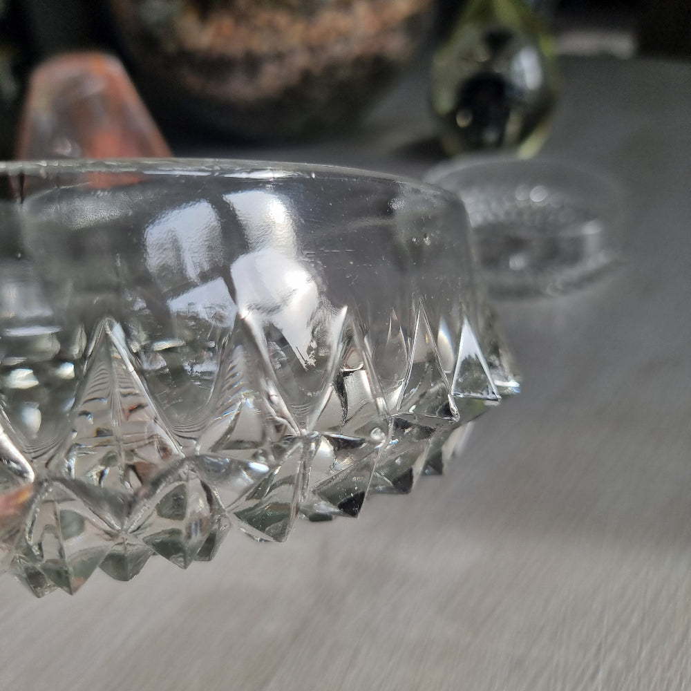 Pressed glass diamond point bowl set with one large and two small bowls, sparkling in natural light