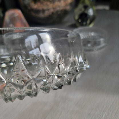 Pressed glass diamond point bowl set with one large and two small bowls, sparkling in natural light