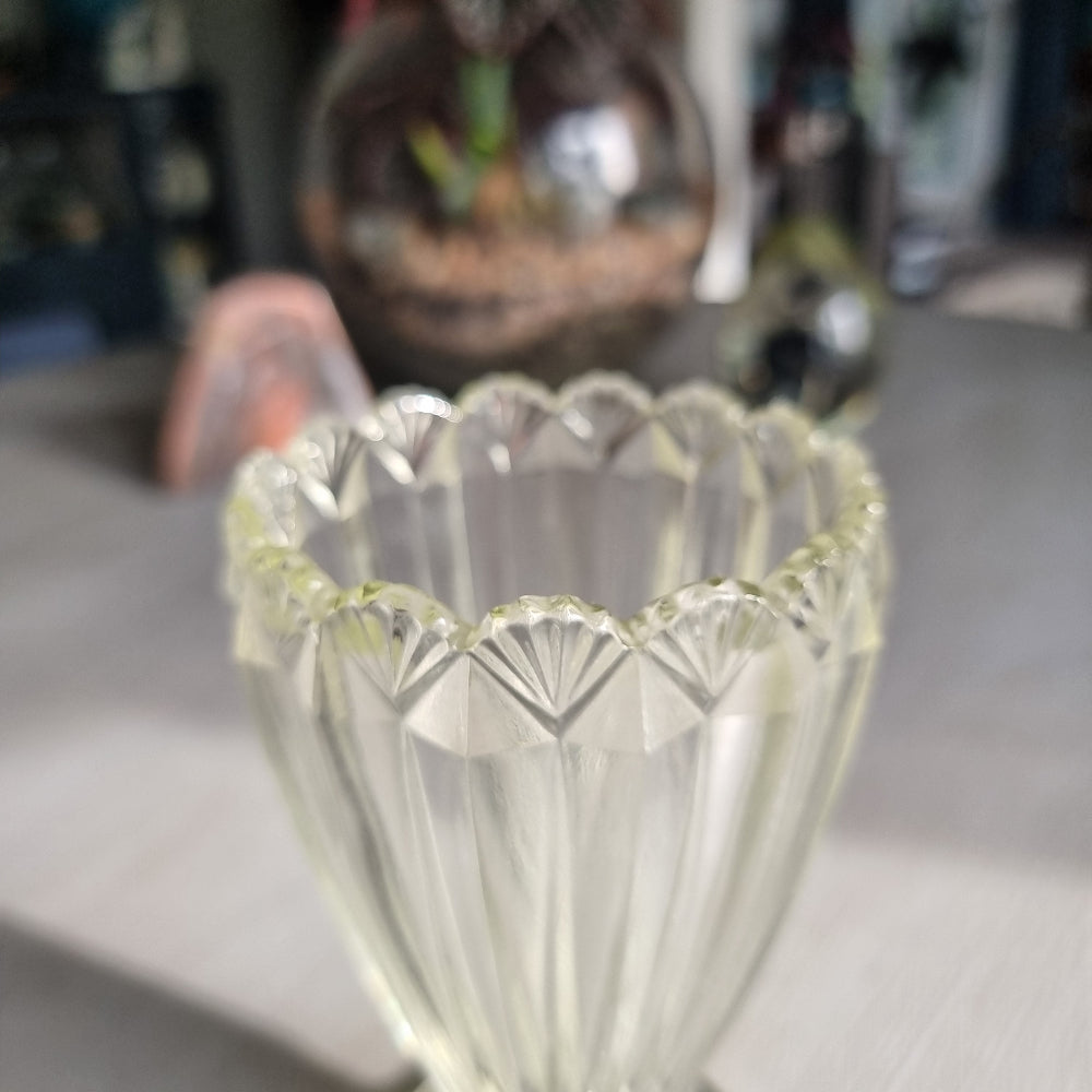 Clear depression glass vase with scalloped rim and fluted art deco design