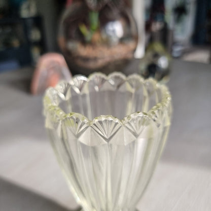 Clear depression glass vase with scalloped rim and fluted art deco design