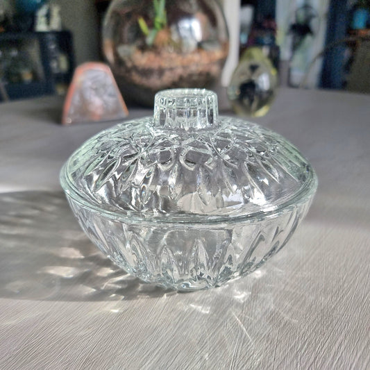 Pasari glass trinket dish with lid featuring pressed floral pattern and clear glass finish