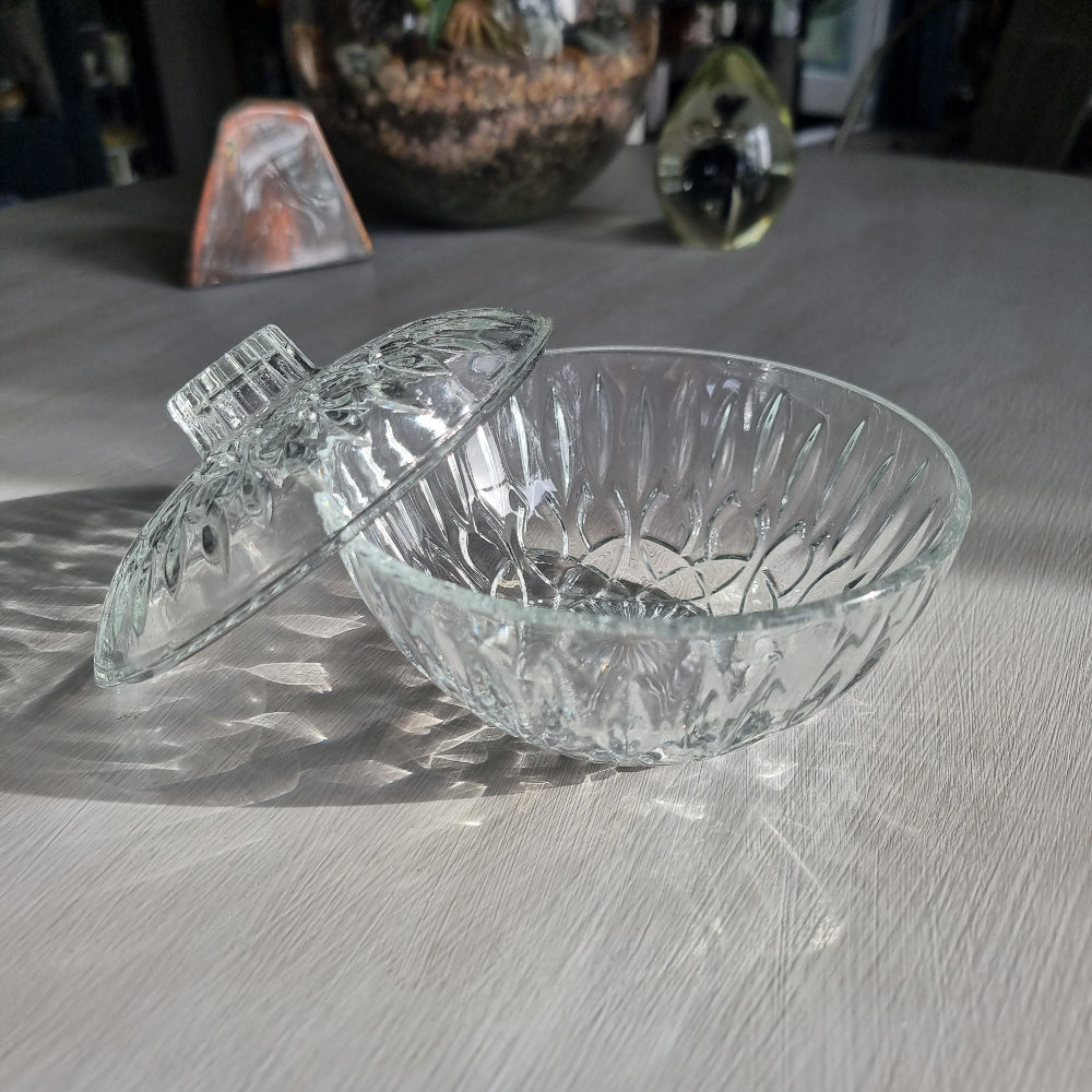 Pasari glass trinket dish with lid featuring pressed floral pattern and clear glass finish