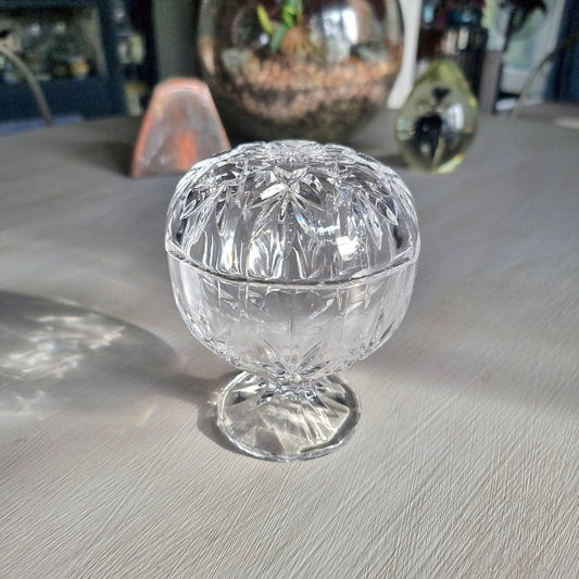 Cut crystal lidded trinket dish on pedestal with starburst pattern and faceted design