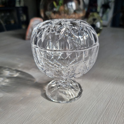 Cut crystal lidded trinket dish on pedestal with starburst pattern and faceted design