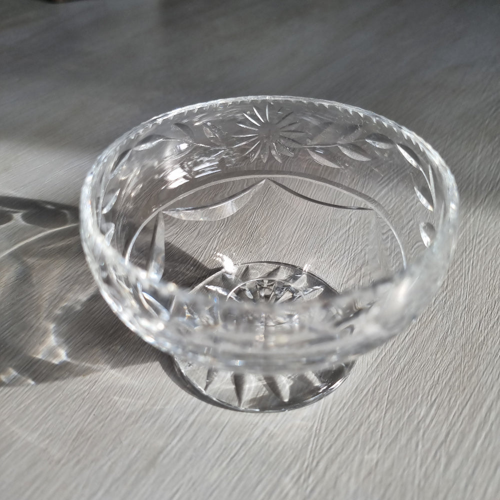 Cut crystal pedestal bowl with etched floral and leaf design and scalloped rim