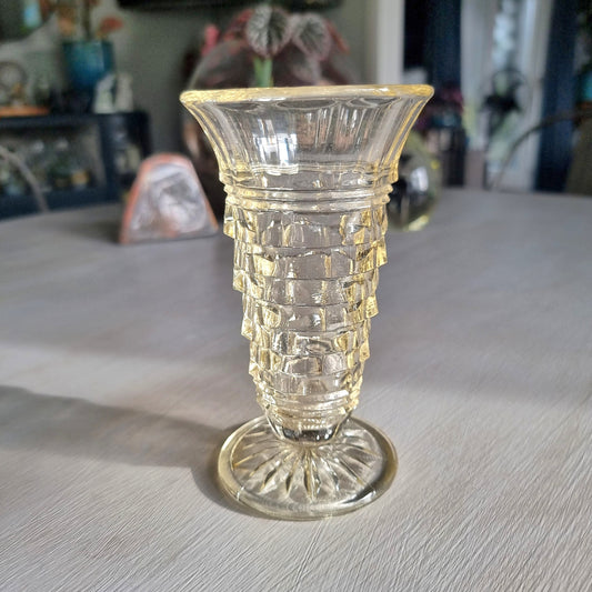 Art deco pressed glass vase with stepped geometric pattern and flared top