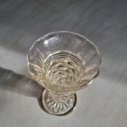 Art deco pressed glass vase with stepped geometric pattern and flared top
