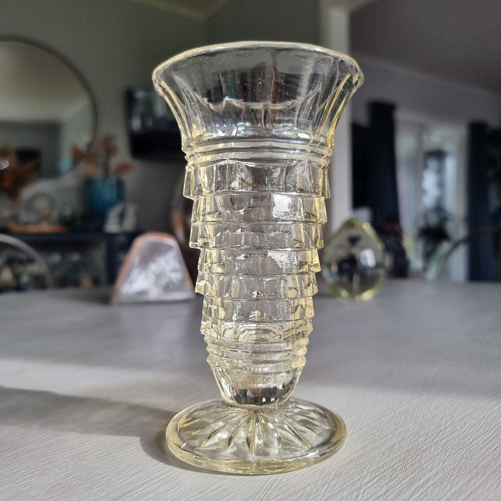 Art deco pressed glass vase with stepped geometric pattern and flared top