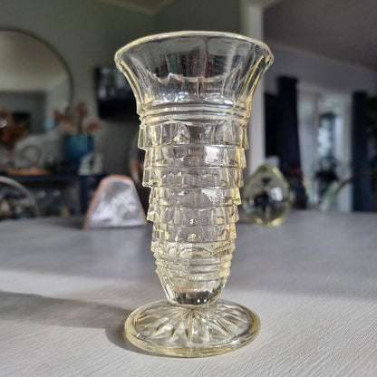 Art deco pressed glass vase with stepped geometric pattern and flared top
