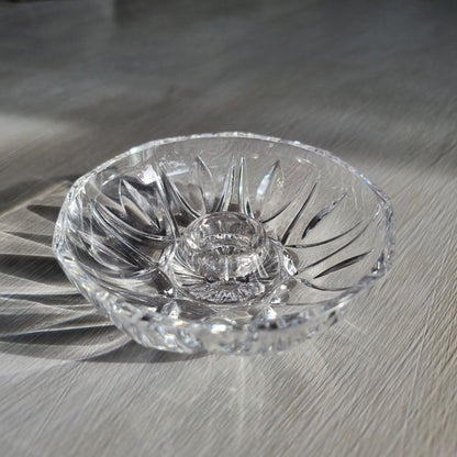 Vintage cut crystal candle holder with starburst pattern, overhead view showing sunburst cut detail