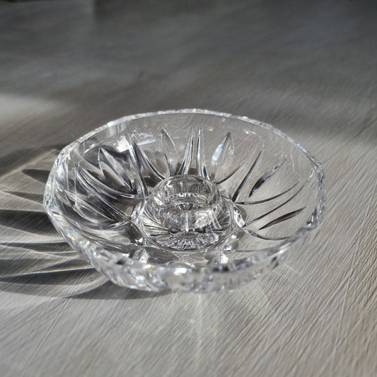 Vintage cut crystal candle holder with starburst pattern, overhead view showing sunburst cut detail