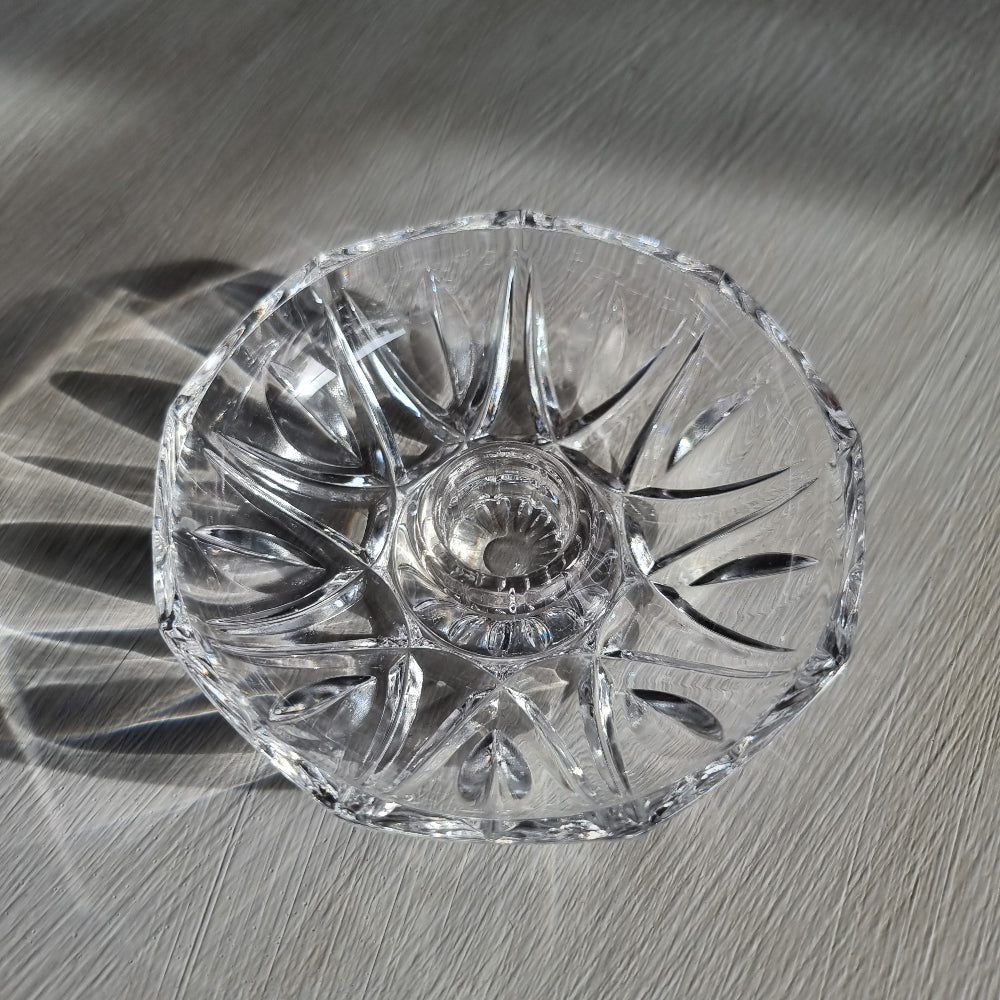Vintage cut crystal candle holder with starburst pattern, overhead view showing sunburst cut detail