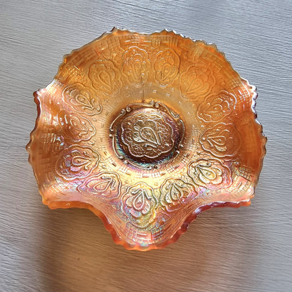 Vintage Fenton Persian Medallion marigold carnival glass bowl with ruffled edges and iridescent finish.
