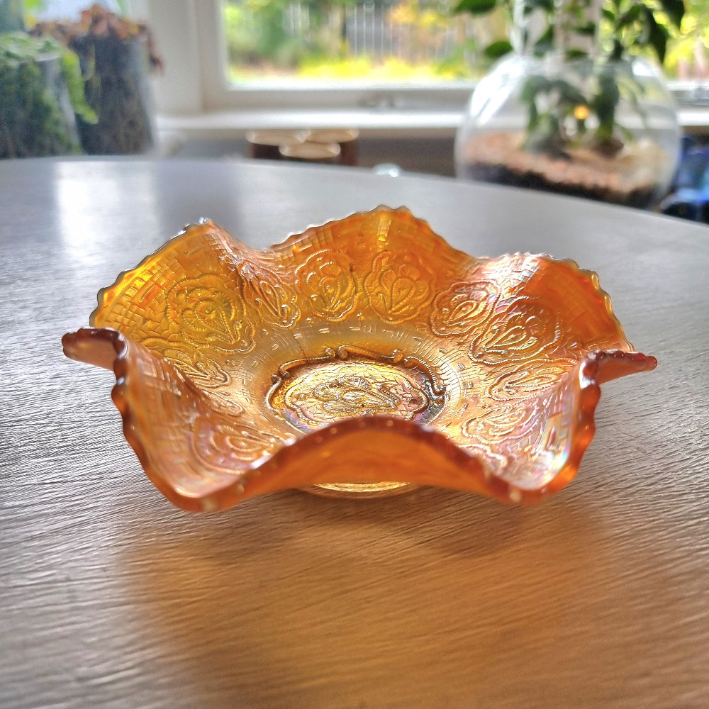 Vintage Fenton Persian Medallion marigold carnival glass bowl with ruffled edges and iridescent finish.
