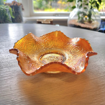 Vintage Fenton Persian Medallion marigold carnival glass bowl with ruffled edges and iridescent finish.