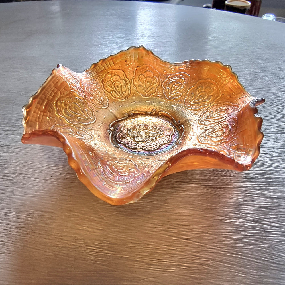 Vintage Fenton Persian Medallion marigold carnival glass bowl with ruffled edges and iridescent finish.