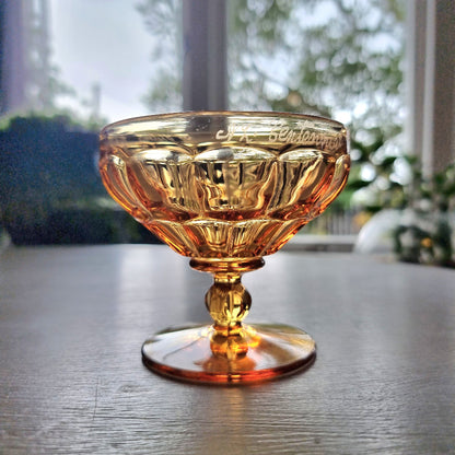 Vintage amber pedestal glass engraved with NZ Centennial Exhibition 1940 inscription and faceted bowl design.