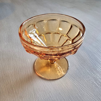 Vintage amber pedestal glass engraved with NZ Centennial Exhibition 1940 inscription and faceted bowl design.