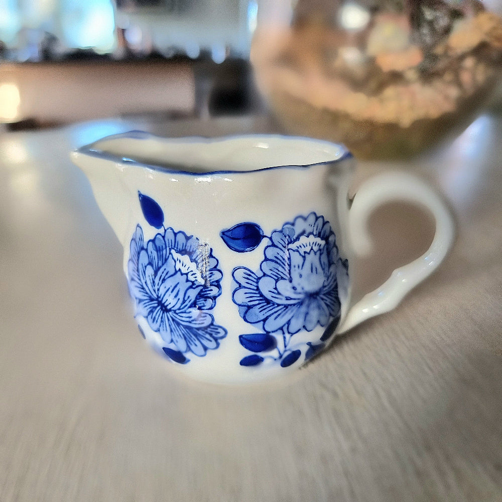 Vintage blue and white hand painted peony creamer jug with scalloped rim and double pour spout