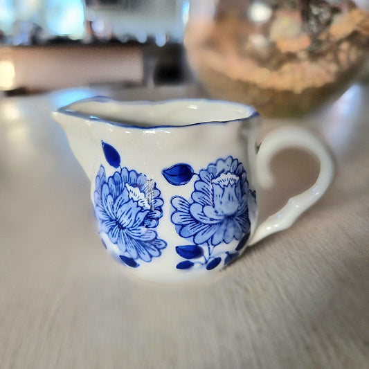 Vintage blue and white hand painted peony creamer jug with scalloped rim and double pour spout