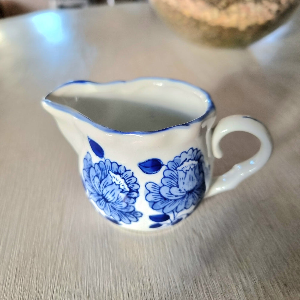 Vintage blue and white hand painted peony creamer jug with scalloped rim and double pour spout
