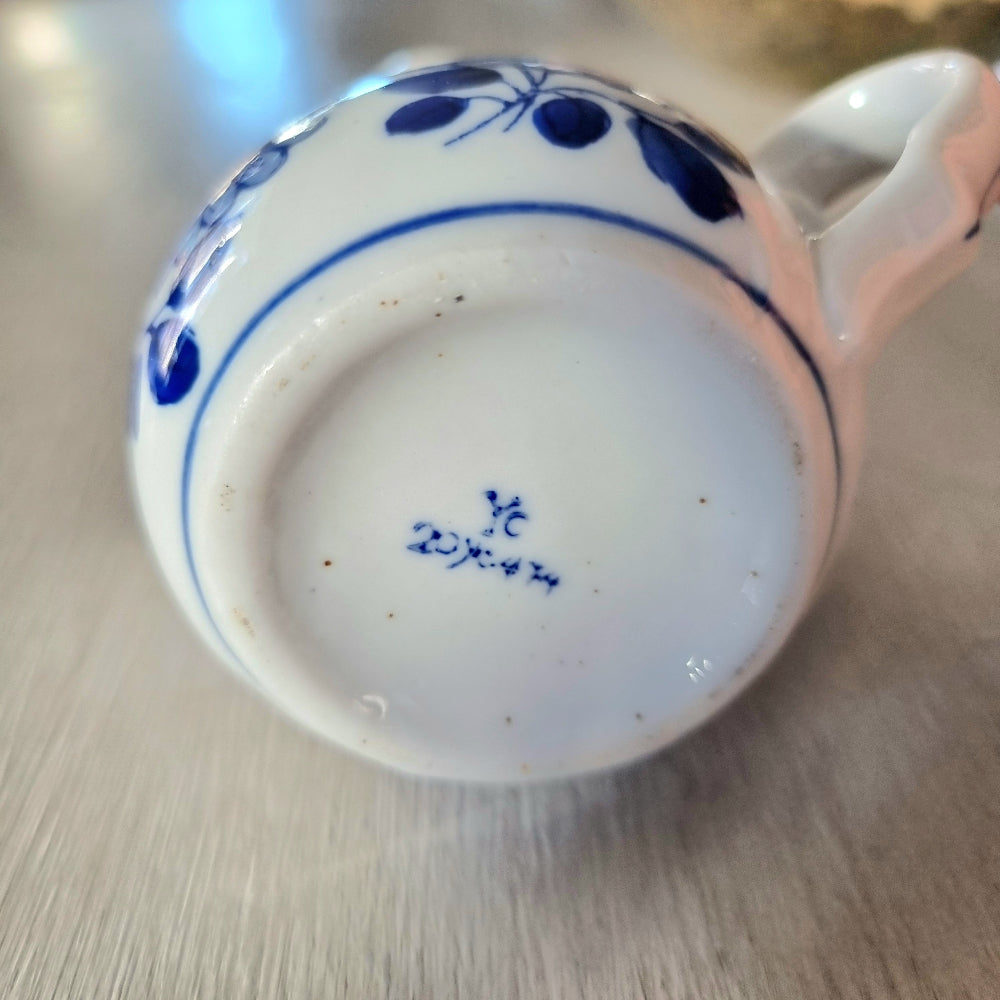 Vintage blue and white hand painted peony creamer jug with scalloped rim and double pour spout