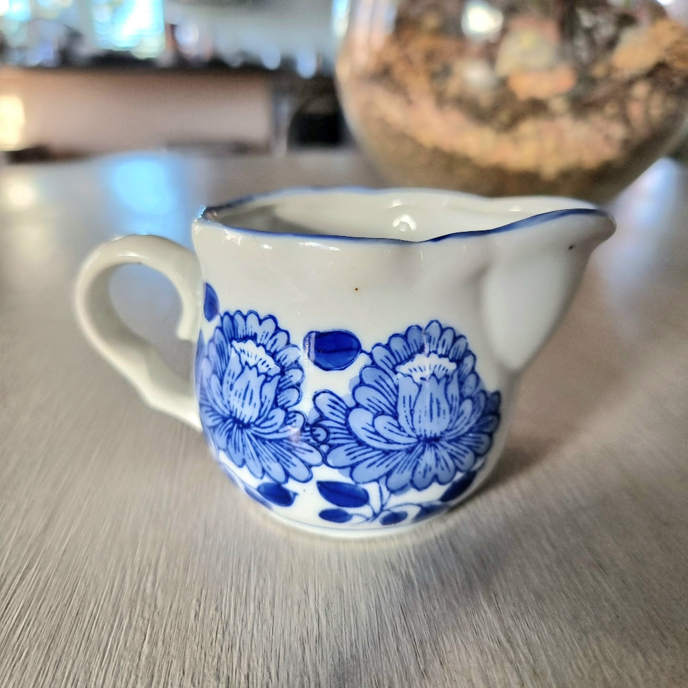 Vintage blue and white hand painted peony creamer jug with scalloped rim and double pour spout