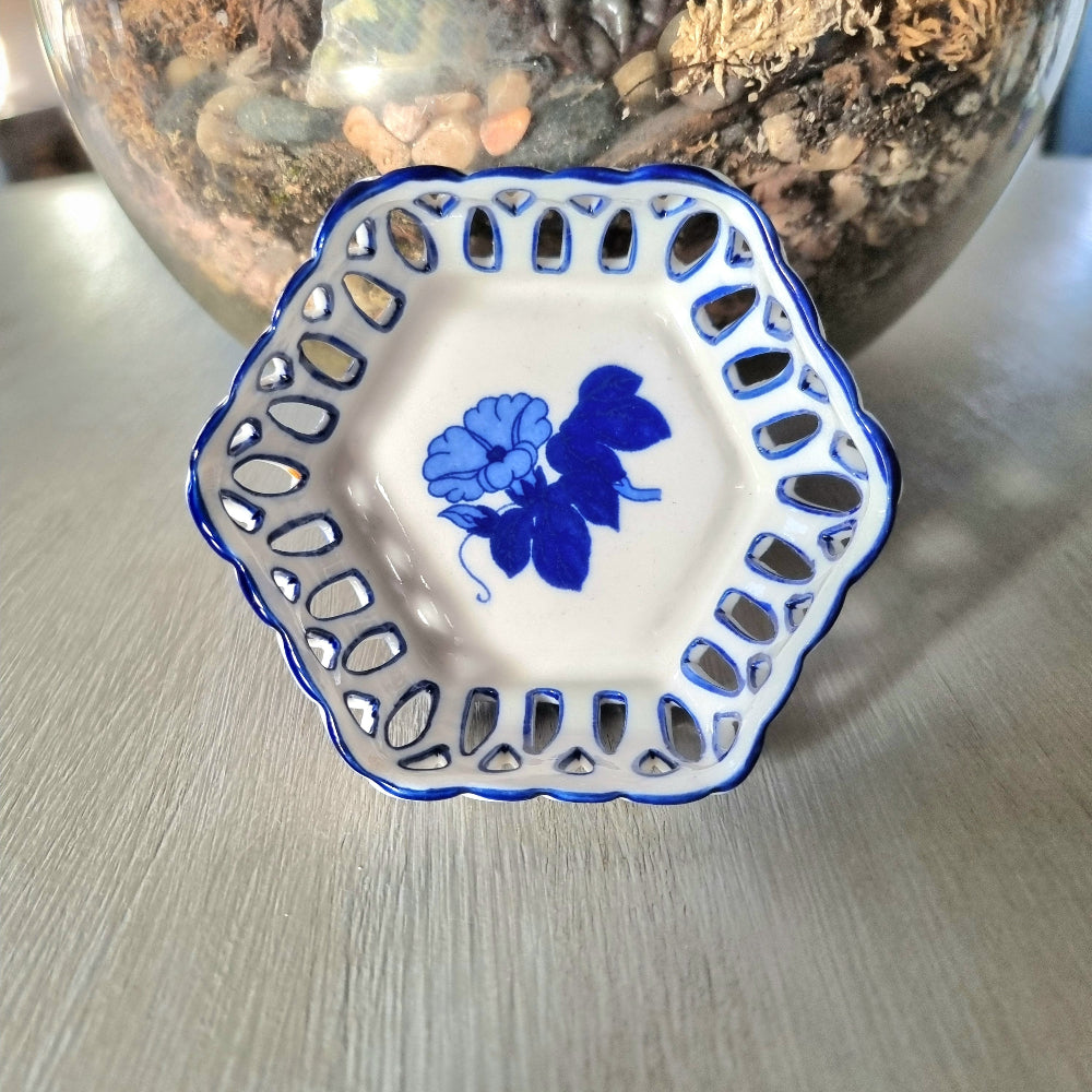 Pair of vintage blue and white reticulated porcelain trinket dishes with pierced lattice border and floral motif, one hexagonal and one rectangular