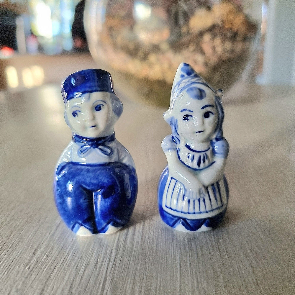 Vintage Delft-style blue and white Dutch boy and girl salt and pepper shaker set