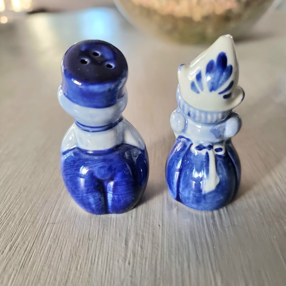 Vintage Delft-style blue and white Dutch boy and girl salt and pepper shaker set