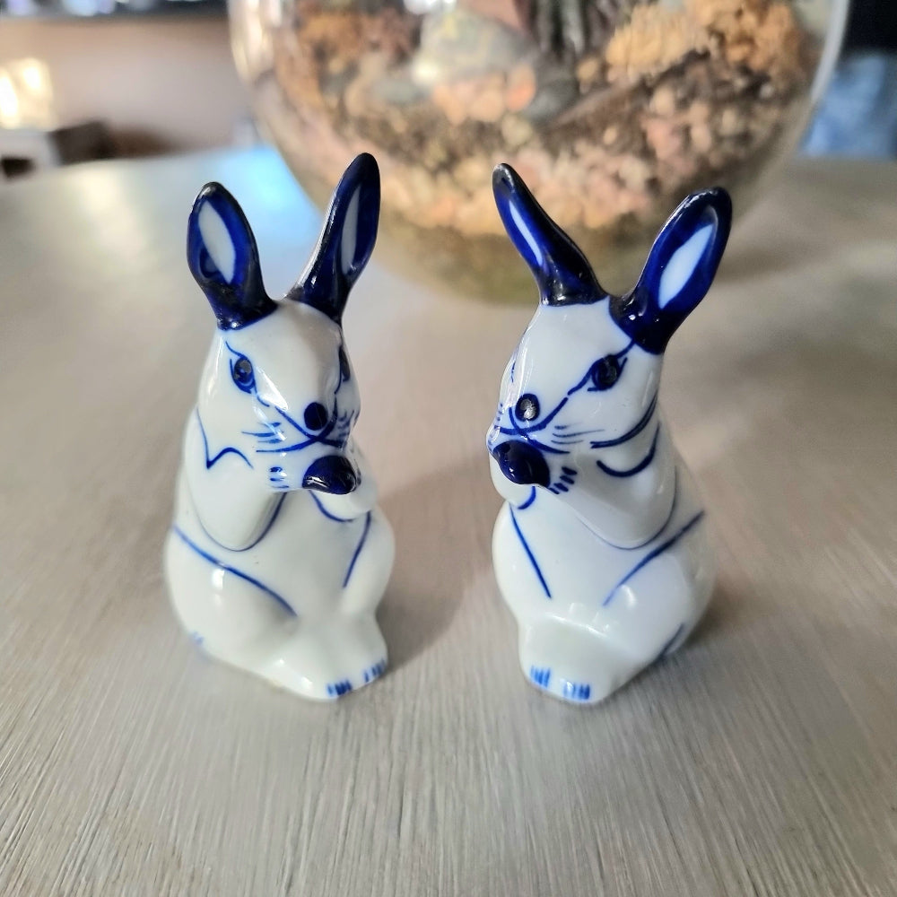 Pair of vintage blue and white porcelain rabbit ornaments with cobalt blue ears and detail, Delft style bunny figurines