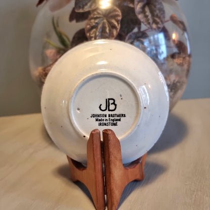 Vintage Johnson Brothers ironstone dish with orange floral bouquet and speckled white ground