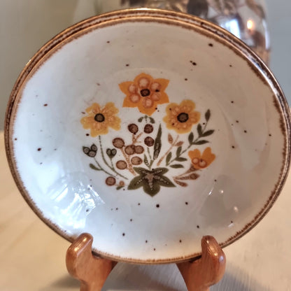 Vintage Johnson Brothers ironstone dish with orange floral bouquet and speckled white ground